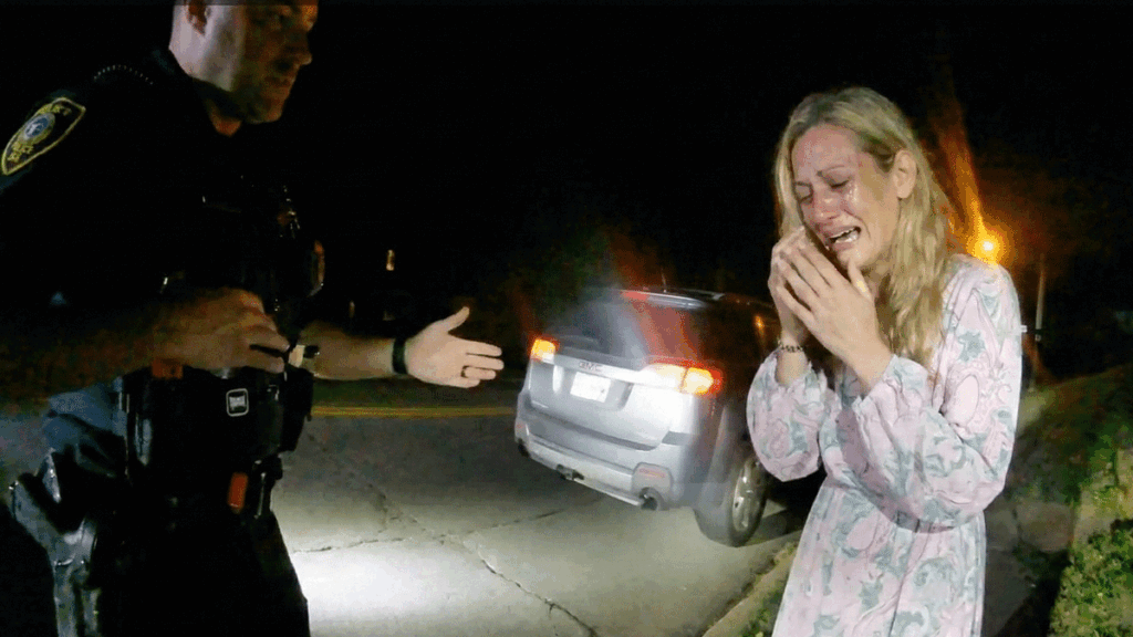 Little Silver police bodycam drug arrest scene showing officers searching a gray wagon.