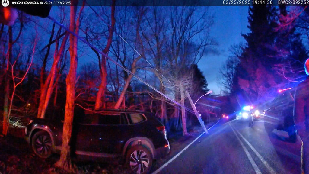 Millburn Drunk Driver Bodycam showing officers inspecting a severed utility pole on Hobart Avenue.