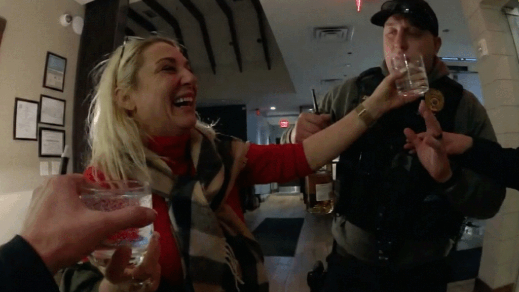 Sea Bright disorderly conduct arrest showing officers escorting a woman outside a restaurant at night.