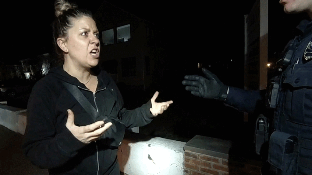 Belligerent Audi driver DWI arrest scene showing white convertible and police lights.