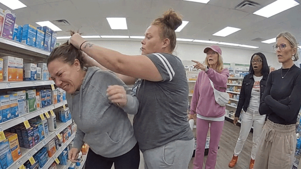 Keansburg Pharmacy assault arrest scene with police reviewing security footage.