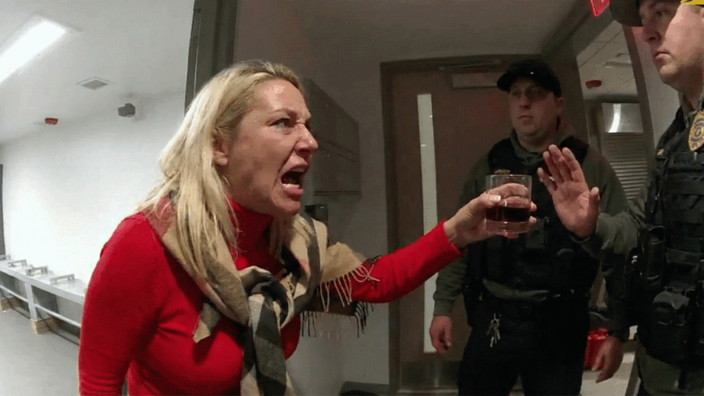 Sea Bright disorderly conduct arrest showing officers escorting a woman outside a restaurant at night.