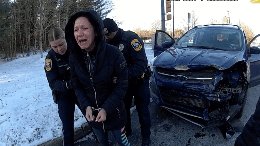 Holmdel car crash arrest scene with officers interviewing drivers.