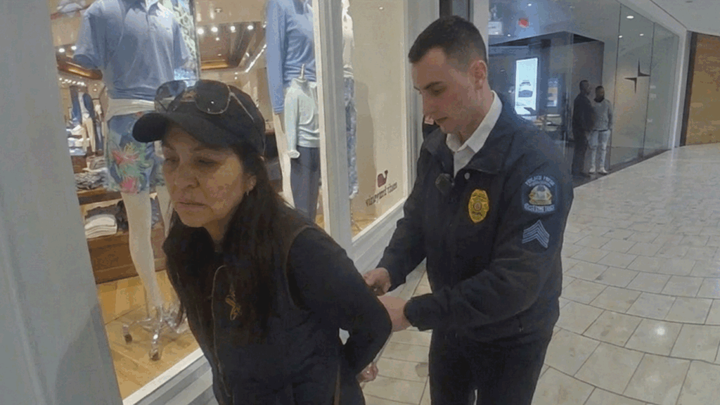 Short Hills Mall Shoplifting Arrest showing police confronting a suspect with stolen Versace sunglasses.