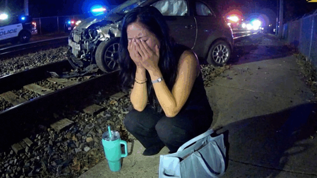 Athens DUI Arrest showing officers questioning a suspect near train tracks.