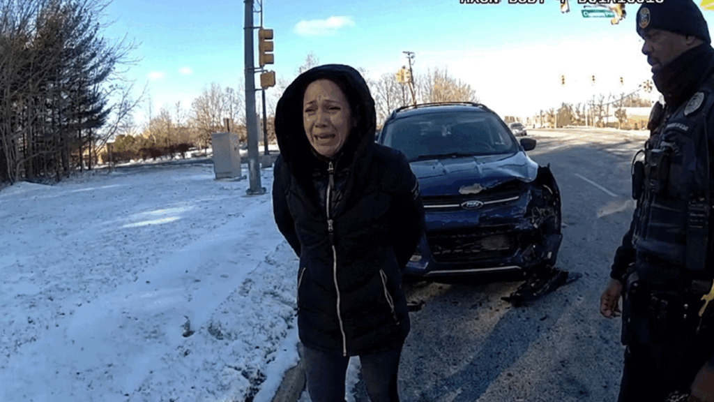 Holmdel car crash arrest scene with officers interviewing drivers.