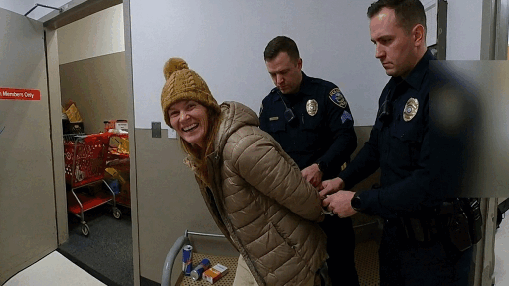 Robyn Karabin Shoplifting Arrest showing Middletown Police Department officers processing the suspect.