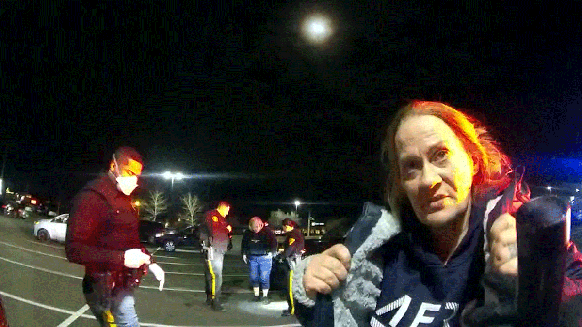 Jermaine Lennon Arrest Bodycam footage showing officers conducting a vehicle search in a parking lot.