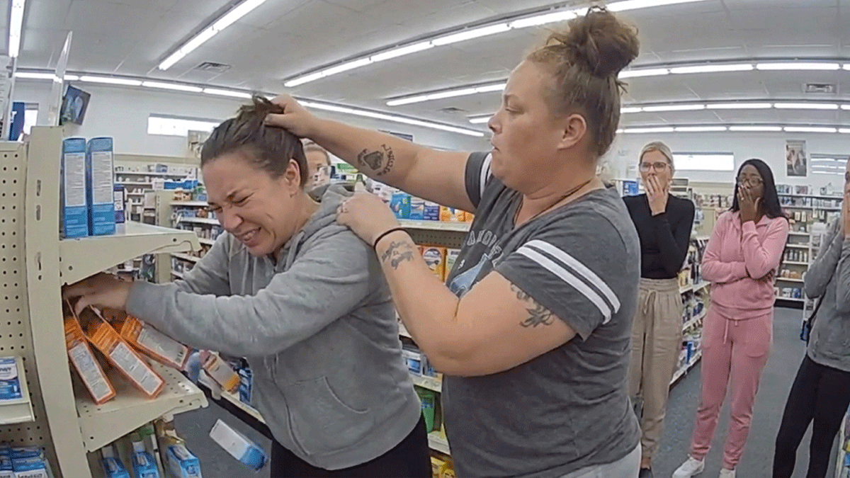 Keansburg Pharmacy assault arrest scene with police reviewing security footage.