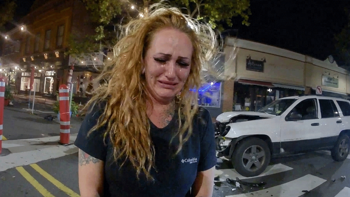 Red Bank DWI arrest scene showing police officer speaking with suspect Emily Wilson on Broad Street.