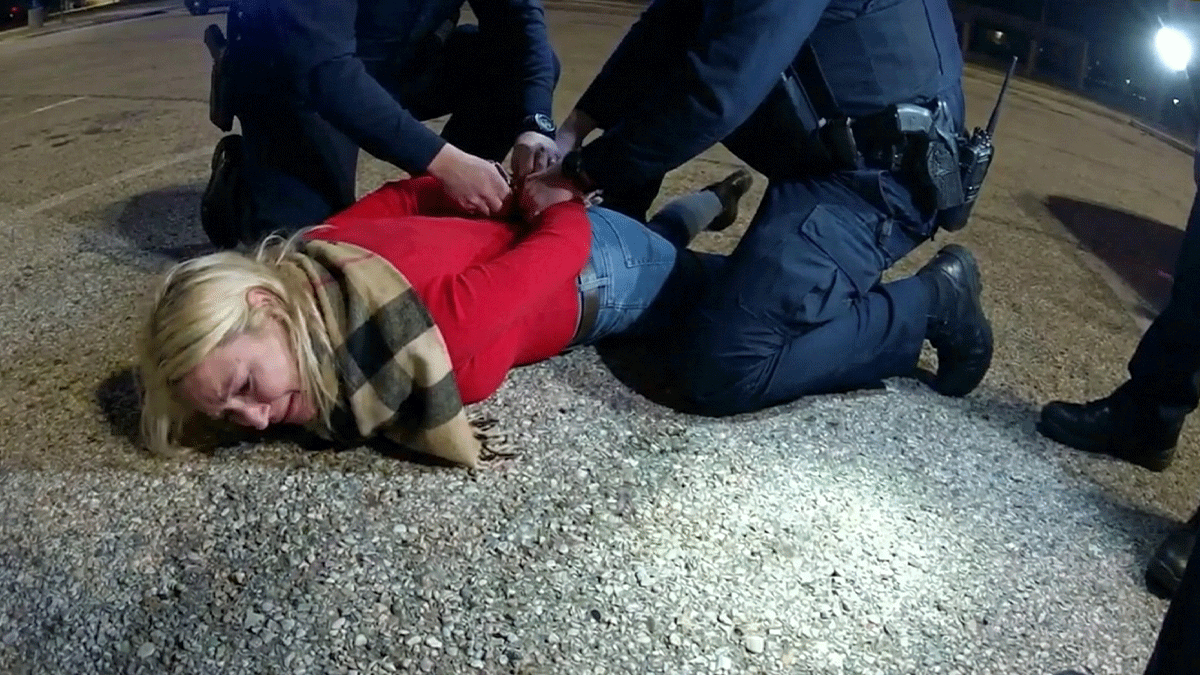 Sea Bright disorderly conduct arrest showing officers escorting a woman outside a restaurant at night.