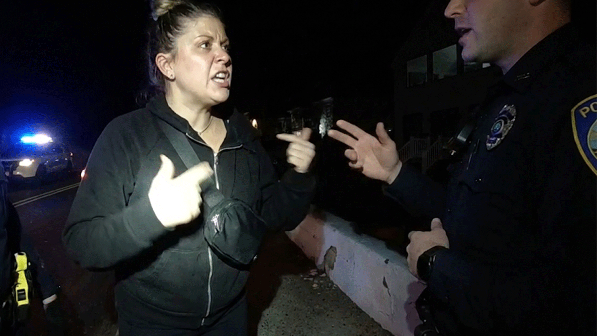 Belligerent Audi driver DWI arrest scene showing white convertible and police lights.