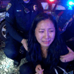 Athens DUI Arrest showing officers questioning a suspect near train tracks.