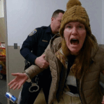 Robyn Karabin Shoplifting Arrest showing Middletown Police Department officers processing the suspect.