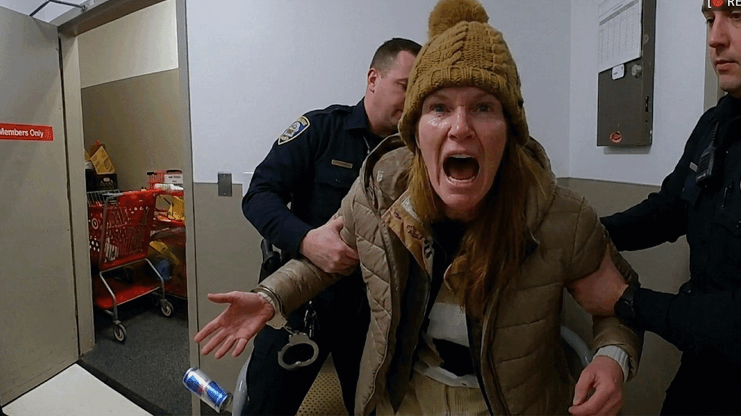 Robyn Karabin Shoplifting Arrest showing Middletown Police Department officers processing the suspect.